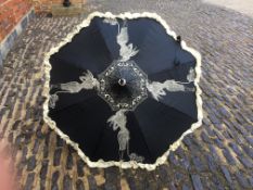 Simon Parasol, black with bow shaped handle. Cream sillouhette of lady walking her dog and cream