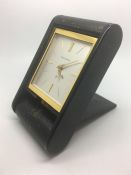 Vintage Jaeger LeCoultre '8 Day' Alarm Clock, square linen dial gold baton hour markers.