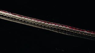 Synthetic ruby line bracelet, set with square step cut rubies, mounted in white metal, length
