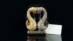 Diamond double swan brooch, designed as two swans sat on a perch, with their heads together