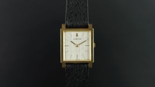 GENTLEMEN'S CORUM 18K GOLD WRISTWATCH W/ PAPER WORK, square linen silver dial with baton hour