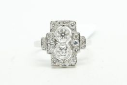 Art Deco style diamond ring, central vertical panel set with two round brilliant cut diamonds,