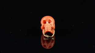 Coral carved skull bead