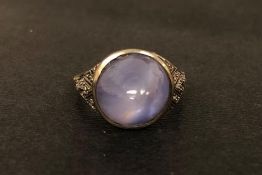 Star sapphire and diamond ring, central round cabochon cut star sapphire, with diamond set