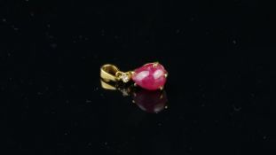 Ruby and diamond pendant, pear cabochon cut ruby set below a round brilliant cut diamonds, mounted