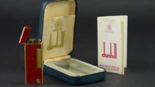 DUNHILL LIGHTER W/ BOX & PAPERS, g/p Dunhill lighter, with red lacquer and gold flecks, comes with