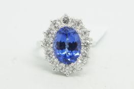 Tanzanite and diamond cluster ring, central oval cut tanzanite, weighing an estimated 4.50ct,