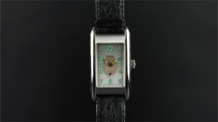 GENTLEMEN'S MOVADO STAINLESS STEEL WRISTWATCH, rectangular silver dial with green Arabic numerals