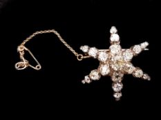 Victorian diamond star brooch, six ray star, set with old cut diamonds, central stone weighing an
