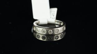 Diamond half eternity ring, round brilliant cut diamonds, rubover set in 9ct white gold, ring size