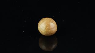 Loose natural undrilled pearl, together with gem and pearl lab certificate, stating round brown