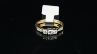 A cubic zirconia ring, set in yellow metal, ring size L