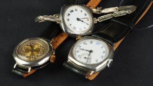 THREE PERIOD SILVER WATCHES INCLUDING LONGINES, a porcelain dial silver case trench watch, blue