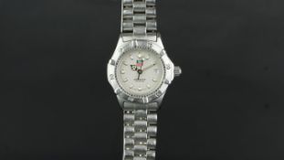 LADIES' TAG HEUER PROFESSIONAL REF. WE1411-R, circular grey dial with luminous hour markers and a