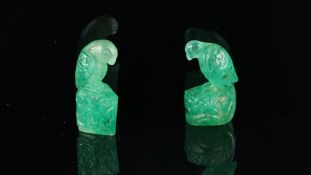 A pair of carved emerald parrot figures, approximately 167cts of emerald finely carved with a parrot