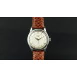 GENTLEMENâ€™S VINTAGE LONGINES, circular dial with arrow hour markers, Arabic numerals at 3,6,9