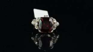 Garnet and diamond ring, central square cushion cut garnet measuring 11.3 x 10.45 x 5.67mm, with
