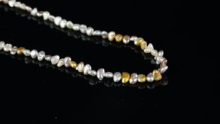Single row pearl necklace, grey, cream and champagne coloured freshwater pearls, on a yellow metal