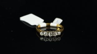 Five stone diamond ring, five old cut diamonds, claw set in white metal on a yellow metal shank,