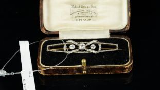 Edwardian diamond bow brooch, set with old cut and rose cut diamonds, designed as a bow, curled