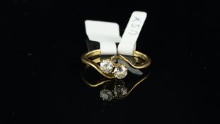 Two stone diamond ring, two old cut diamonds in a crossover position, claw set, mounted in yellow