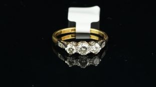 Three stone diamond ring, three round brilliant cut diamonds, weighing an estimated total of 0.55ct,