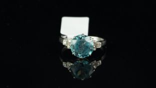 Art Deco zircon and diamond ring, central blue zircon, claw set with three single cut diamonds to