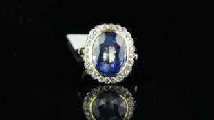 French sapphire and diamond cluster ring, central oval cut sapphire measuring 13.80 x 11.44 x 6.