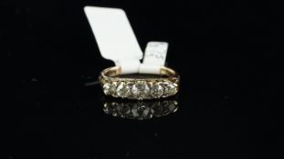 Victorian carved half hoop, five stone diamond ring, five graduated old cut diamonds, in yellow