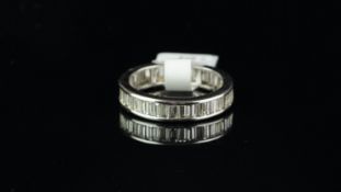 Diamond full eternity ring, baguette cut diamonds weighing an estimated total of 2.50ct, channel set