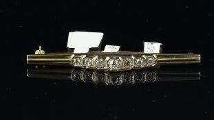 Art Deco bar brooch, set with graduating old cut diamonds, weighing an estimated total of 0.70ct,