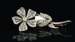 Edwardian diamond floral brooch, set with old and rose cut diamonds, mounted in white and yellow