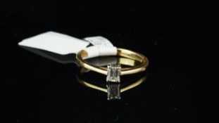 Single stone diamond ring, emerald cut diamond weighing an estimated 0.30ct, set in 18ct yellow