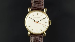 GENTLEMEN'S IWC 18K GOLD VINTAGE DRESS WATCH, circular off white dial with gold baton hour