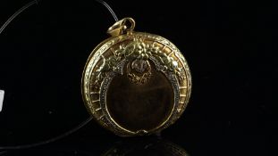 French Art Nouveau locket, circular design with floral detail and rose cut diamonds, reverse