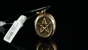 Yellow metal locket, 9ct back and front, engraved floral detail to one side and a pentagram to the