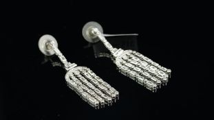 Pair of diamond tassel drop earrings, set with baguette and round brilliant-cut diamonds, mounted in