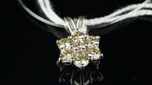 Diamond daisy cluster pendant, seven round brilliant cut diamonds, weighing an estimated 1.50ct,