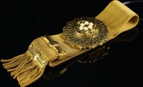 Gilt metal and faux pearl bracelet, with tassel detail