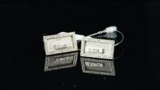 A pair of French diamond set cufflinks, textured white metal rectangular panel, set with five