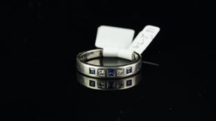 Sapphire and diamond half eternity ring, three square cut sapphires set with a princess cut