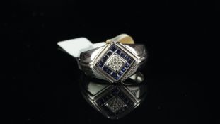 Gentlemen's sapphire and diamond ring, four central round brilliant cut diamonds, surrounded by
