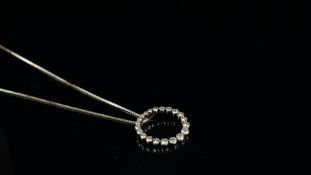 Diamond pendant, twenty graduated round brilliant cut diamonds, set in an open circle, with an EGL