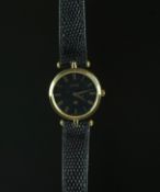 MID SIZE GUCCI WRISTWATCH, circular black dial with Roman numerals, 30mm gold plated case with Gucci