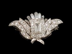 Diamond set clasp, floral spray design, set with emerald cut and round brilliant cut diamonds,