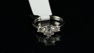 Three stone diamond ring, central old cut diamond weighing an estimated 0.88ct, with a round