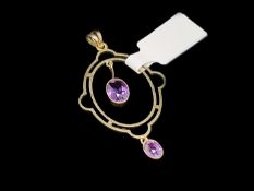 Amethyst pendant, geometric style oval pendant suspending an oval cut amethyst to the centre and a