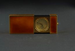 DUPONT TRAVEL CLOCK, tan sunburst enamel case, circular gold dial with gold hour markers and black