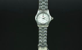 LADIES' TAG HEUER WRISTWATCH REF. WK1311-0, circular white dial with luminous hour markers and a