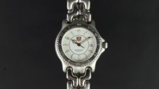 MID SIZE TAG HEUER PROFESSIONAL WRISTWATCH, circular white dial with date aperture and luminous hour